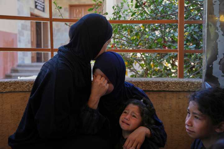 An Israeli strike on Gaza kills 14 Palestinians, mostly women and children, hospitals say