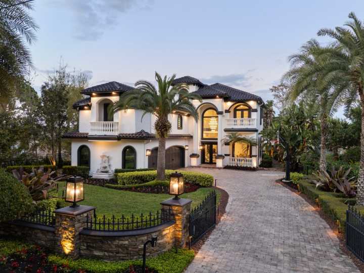 Arching overhead aquarium highlights $4.4M Windermere lakefront estate