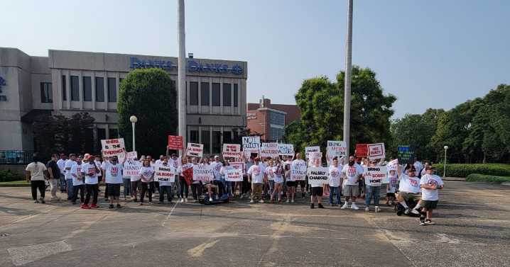 Crowd gathers to protest charge against suspect in murder of local DJ