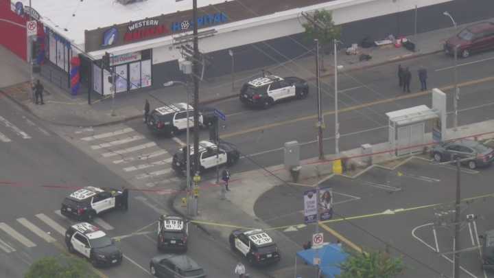 Officers shoot man with gun in Harvard Heights