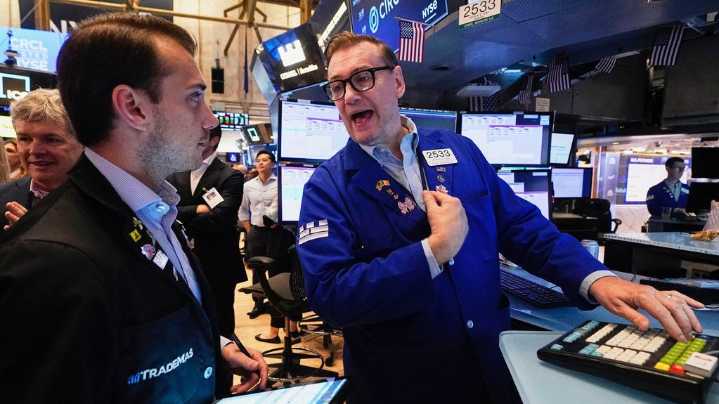 Wall Street gains ground following a solid jobs report and marks another winning week