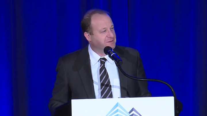 Lawsuit alleges Colorado governor ordered state employees to violate state law, share info with ICE