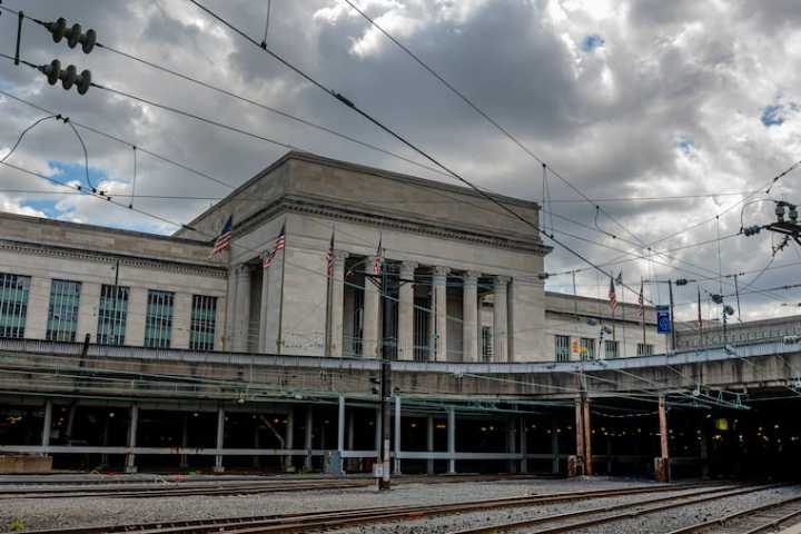 A contractor at 30th Street Station who bribed an Amtrak manager with luxury watches and vacations was sentenced to nearly five years in prison