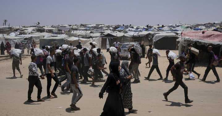 Palestinians say Israeli fire kills 5 near aid sites. Israel says it fired warning shots