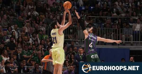 Barcelona escaped from Malaga with a thrilling win in overtime