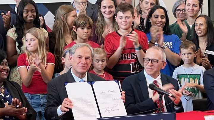 Abbott signs record $8.5 billion investment in public schools, teacher raises