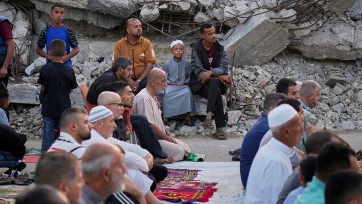 Gaza marks start of Eid with outdoor prayers in rubble - as Israel warns of intensive new military operations