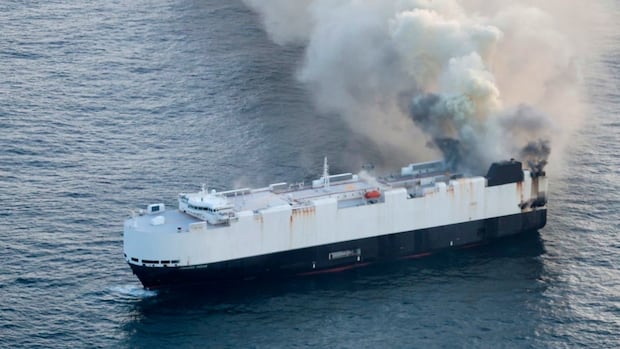 22 crew members rescued from lifeboat in North Pacific after cargo ship carrying 3,000 vehicles catches fire