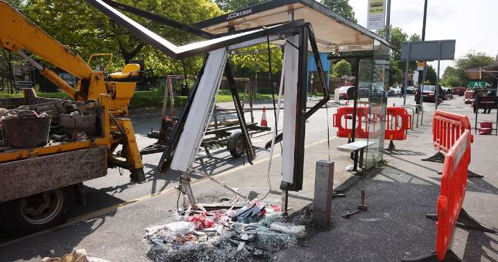 Scene of destruction after car smashes into shop and bus stop with man killed
