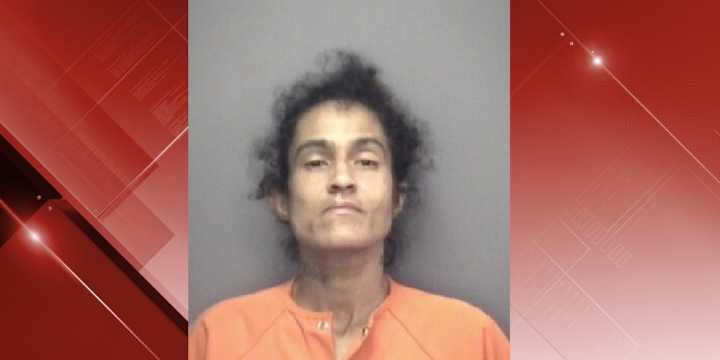Woman charged after roommate found shot