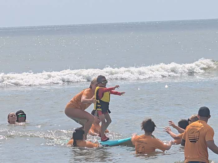 Dozens of surfers catch waves at Brooks Rehabilitation’s annual adaptive surfing event in Jacksonville Beach