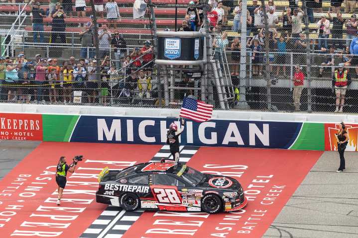 Driver nicknamed ‘Butterbean’ wins Friday Michigan NASCAR race, climbs fence