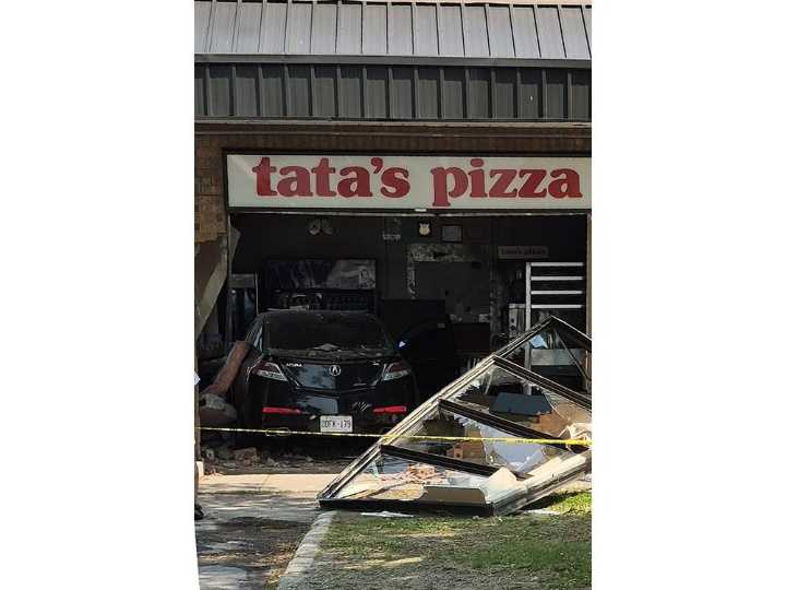 Woman drives car through restaurant window in Kingston