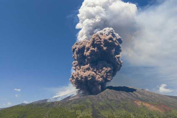 Mount Etna erupts, shooting a massive ash cloud into the sky and raising alerts