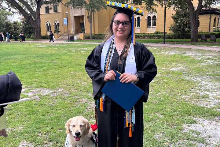 Service Dog Receives Special Honor at Owner's Graduation from Florida School (Exclusive)