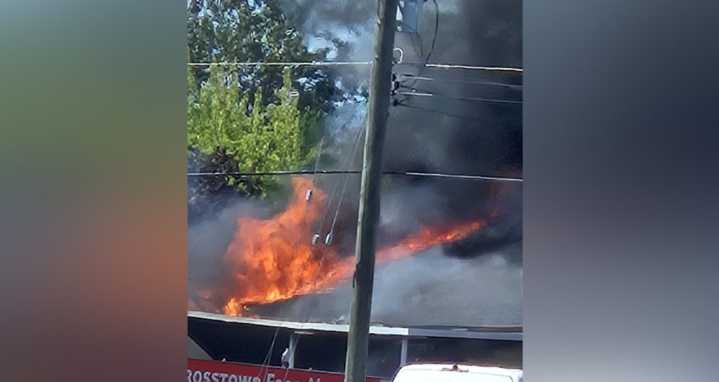 Thick smoke and flames seen at or near business in Surrey Sunday afternoon