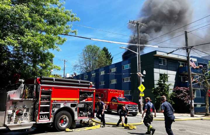 Fire on Capitol Hill apartment rooftop sends up plume of smoke