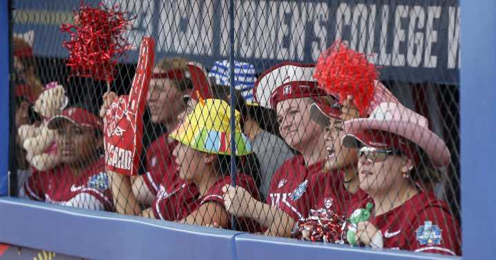 College softball players bring cheers, chants to dugout