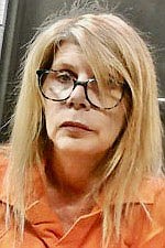 Prosecutor accuses LaRenda Vick of having firearm in violation of pretrial release terms in felony theft case