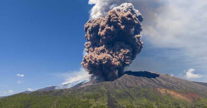 As tourists visit Mount Etna, it erupts filling the air with ash