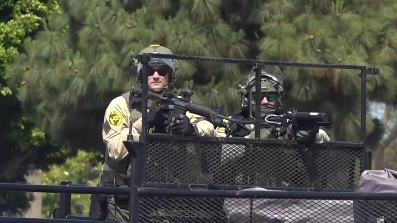 Protesters and immigration authorities face off for a second day in LA area after arrests