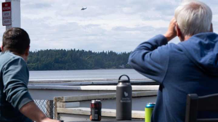 Firefighting helicopter hauls boats from Puget Sound