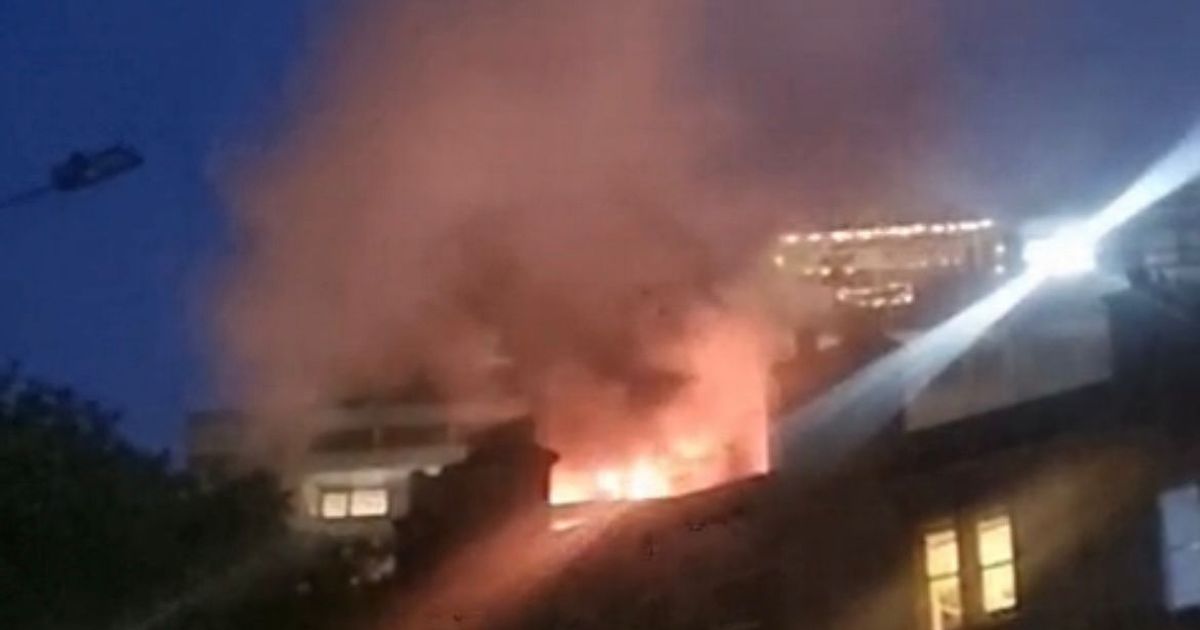 Terrifying moment blaze tears through Edinburgh banana flats as locals watch on