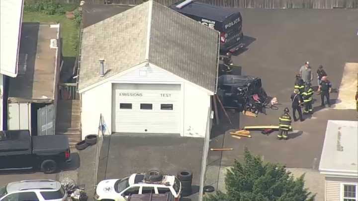 Vehicle crashes into auto shop building in Bensalem Township, Pa.