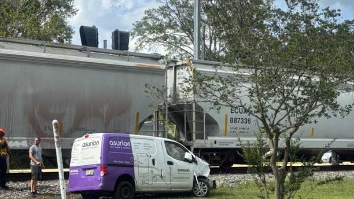 Train hits van just off US 190 in town of Livingston
