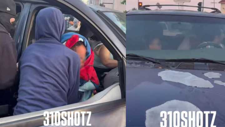 SUV does donuts on LA road with small kids inside, prompting crowd to stop driver