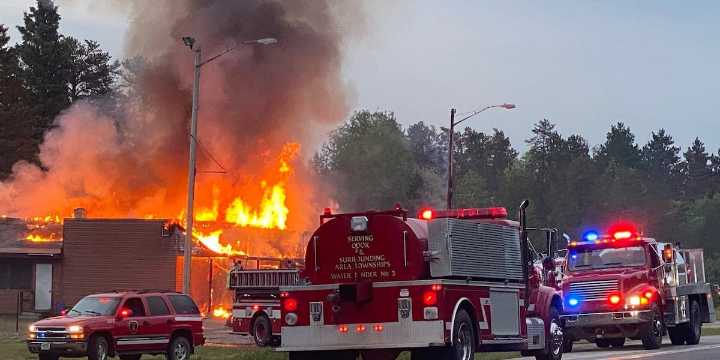 Fire crews respond to engulfed building in Britt