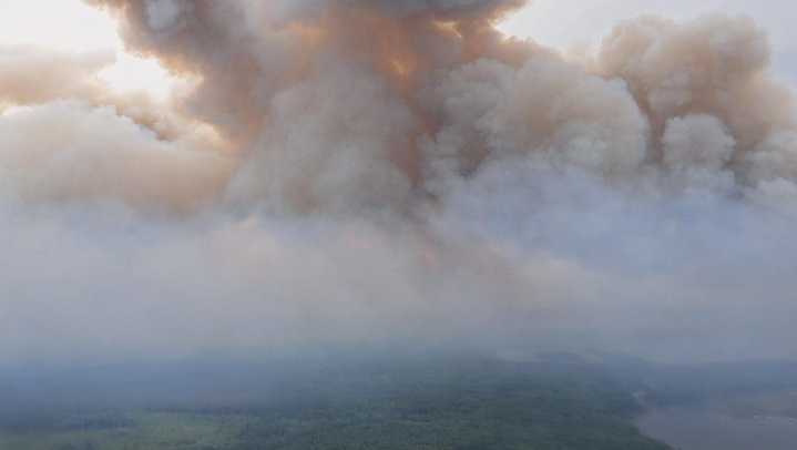 Crews fight heavy winds as fire nears community in northeastern B.C.