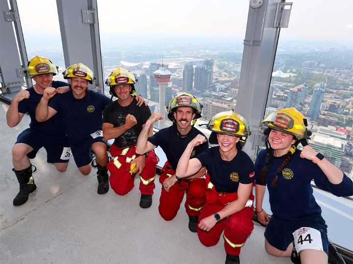 Firefighters climb Calgary's tallest tower to support cancer care