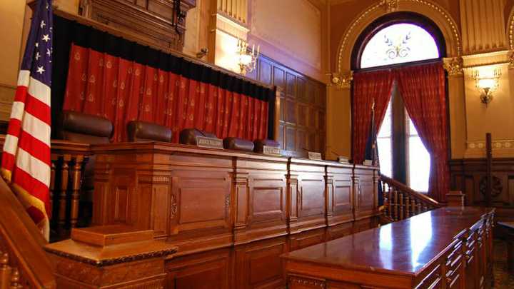 Indiana Supreme Court hears dispute over bush obstruction at rural intersection