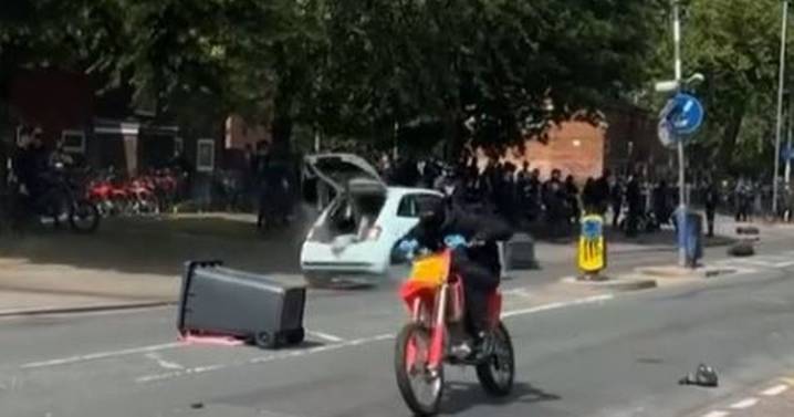 Footage shows mayhem on Salford street during 'serious disorder' as cars and bikes screech down road