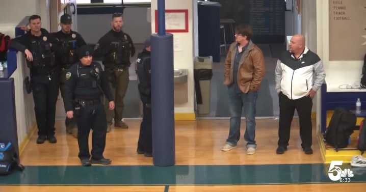 A warrant to arrest former wrestling coach on extortion, bribery