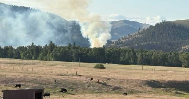 Fire sparked by vehicle burning 25 acres near Ravalli