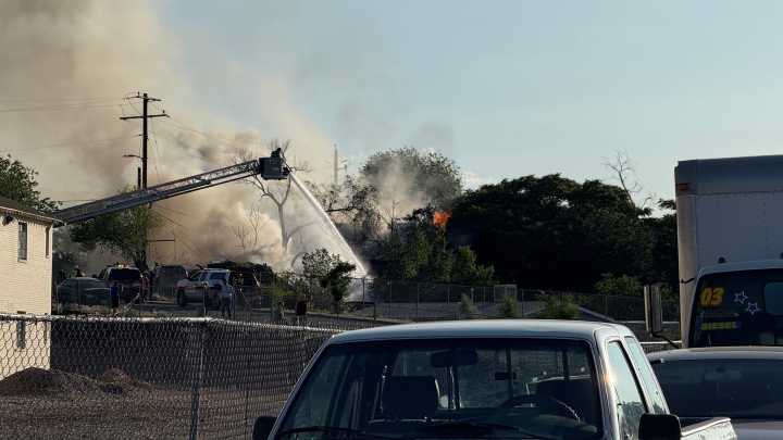 Sparks fire burns structure, debris pile; 2 injured