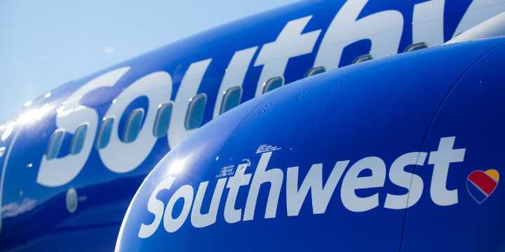 Ohio woman allegedly tried to open plane door midflight, kicked and spit at flight crew