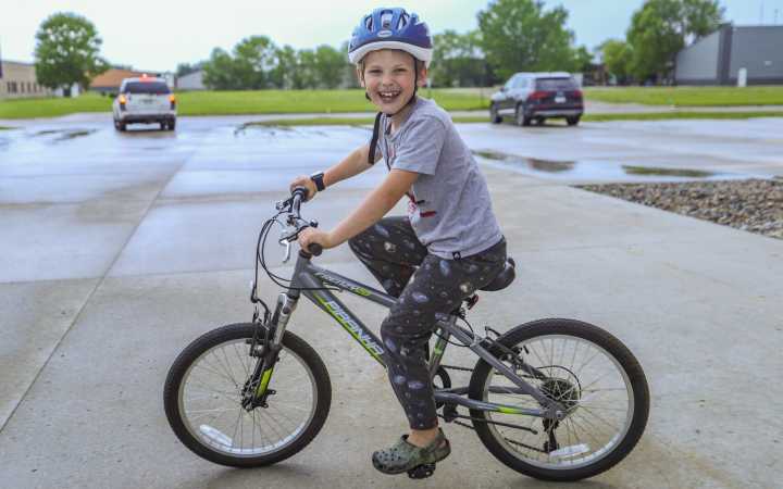 Riding into summer: Moorhead church group distributes bikes to Ellen Hopkins students