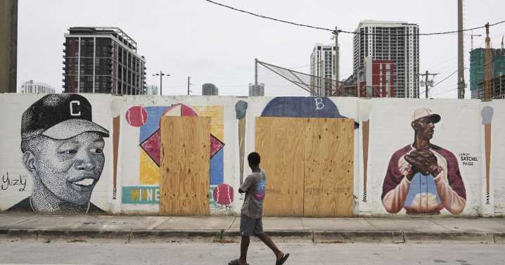 A mural honoring Jackie Robinson and Minnie Miñoso is defaced with racist graffiti in Miami
