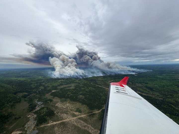 Crews fight heavy winds as fire nears community in northeastern B.C.