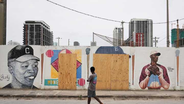 A mural honoring Jackie Robinson and Minnie Miñoso is defaced with racist graffiti in Miami