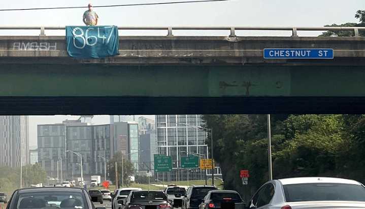 Man Seen Displaying ‘8647’ Sign Above I