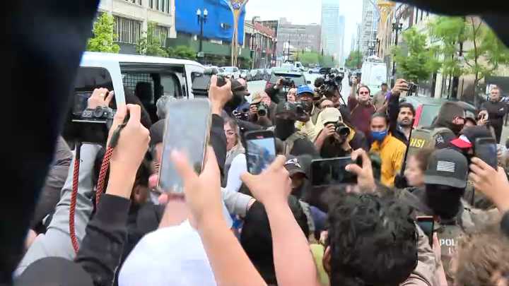 ICE agents confronted by demonstrators during enforcement action