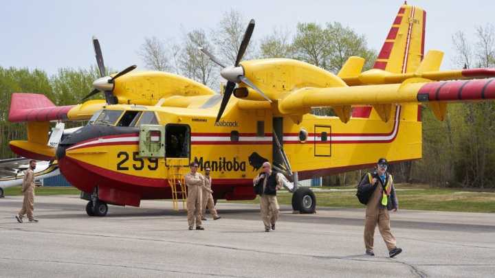 Saskatchewan lays charges in wildfires while 1,000 more flee in Manitoba