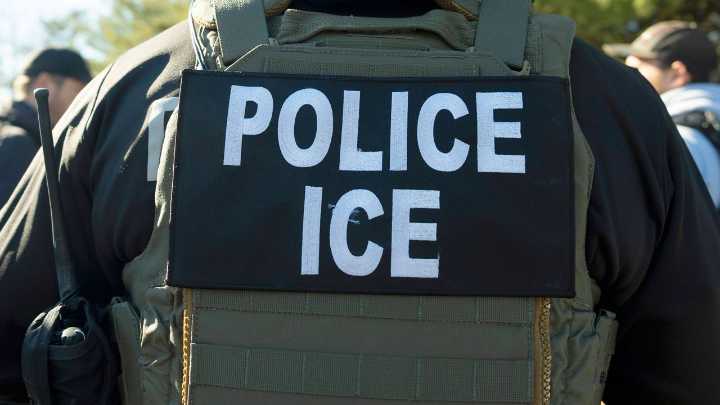 Migrants and ICE officers contend with heat, smog and illness after detoured South Sudan flight