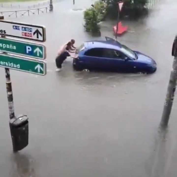 Spain swamped by floods as two-hour rain deluge leaves drivers trapped and streets underwater as emergency declared