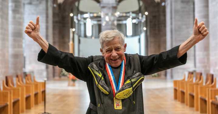 Monk shows off gold medal after winning race at 81