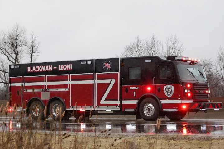 Elderly woman, firefighter injured in Leoni Township house fire